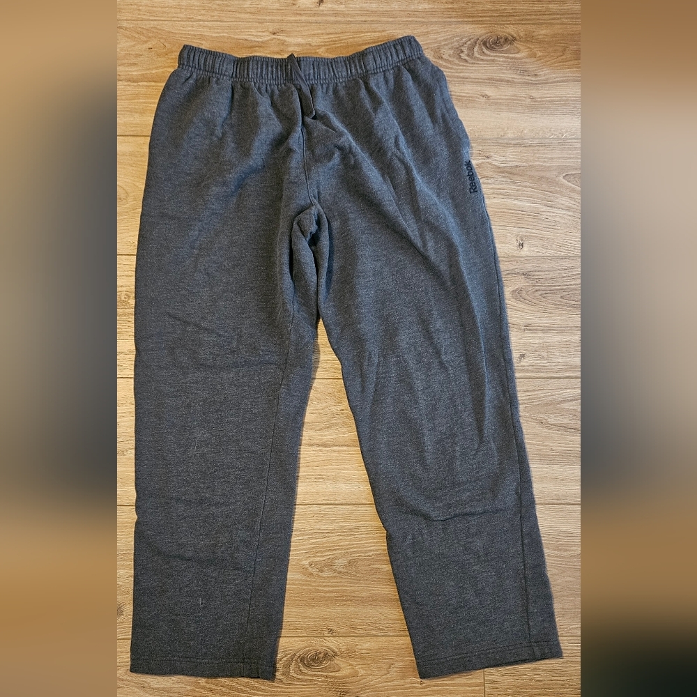 large grey Reebok fleece sweat pants